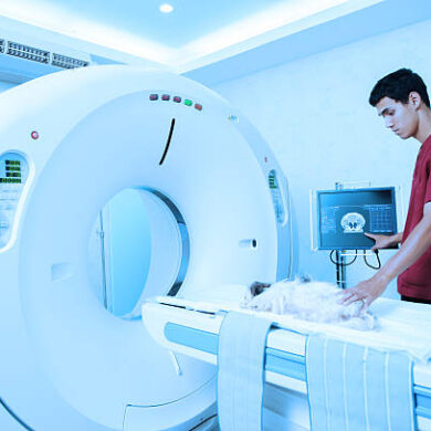 veterinarian assistant working in MRI scanner room take with blue filter